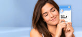 Woman holding a Spot Saviour product against a blue background.
